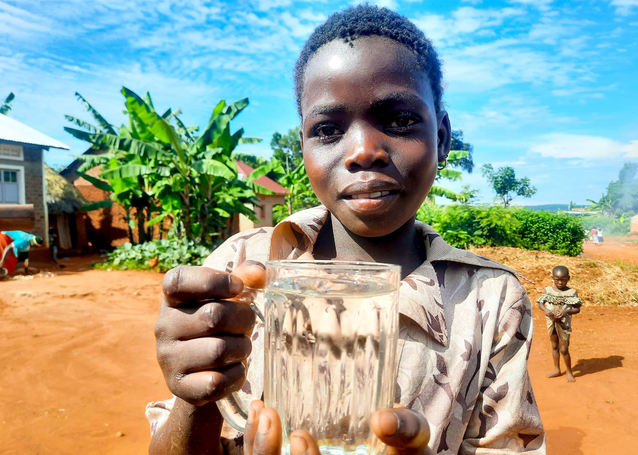Janet is drinking safe water from hand pump well -2