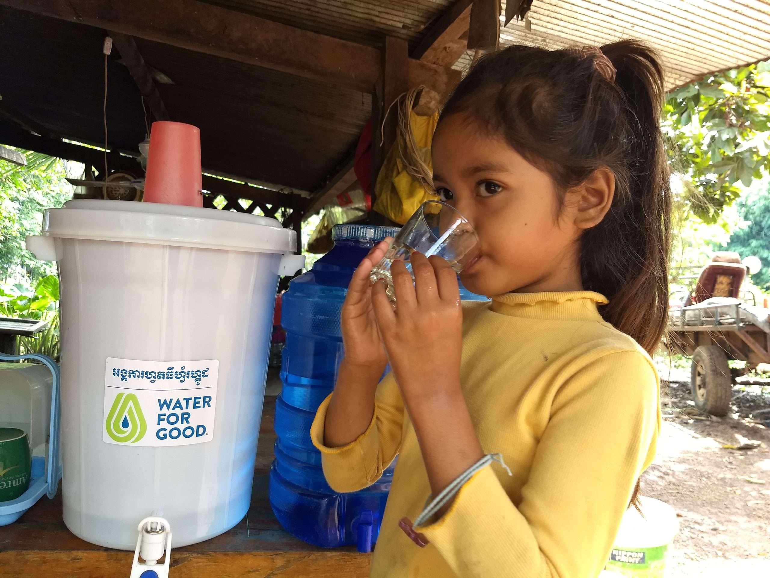 A child drinking water from a glass #4